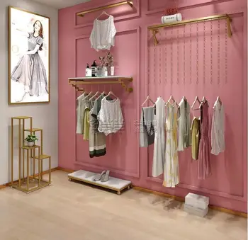 Loja de roupa cremalheira de exposição do gancho de ouro parte de cima da parede do lado do pendura combinação de parede gancho a loja de roupas femininas cabide pendurado na parede